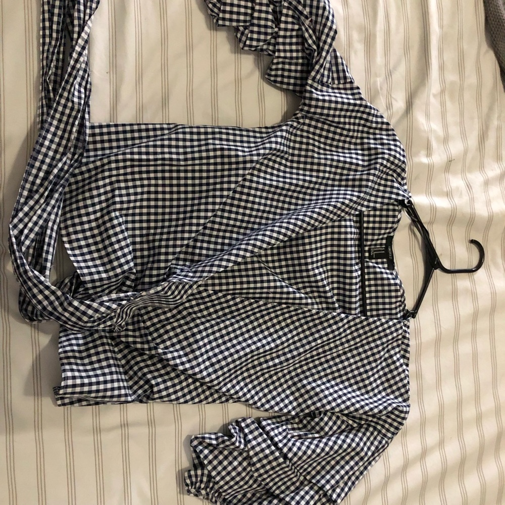 Blue and white checkered blouse